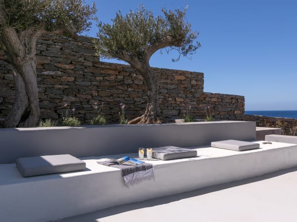 The cushioned in-built sitting area by the pool 